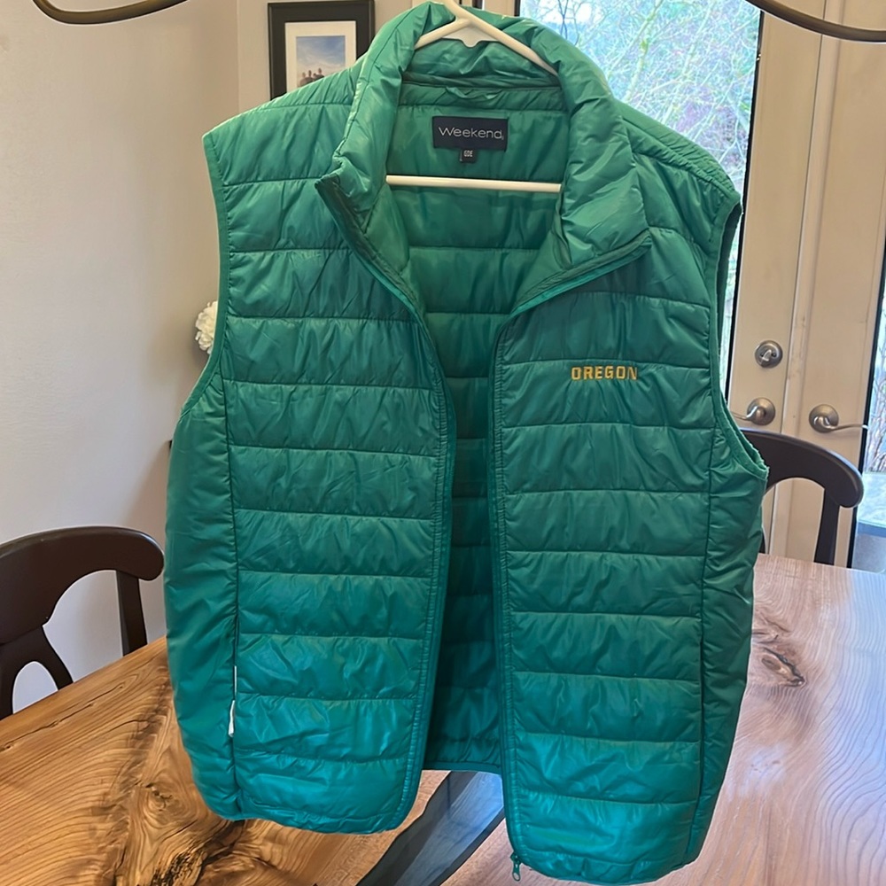 Green vest with Oregon label. Good condition